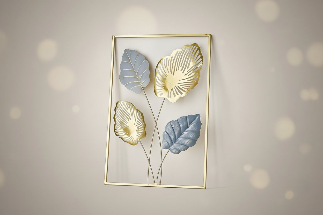 A metal wall decor featuring gold, gray, and light blue leaf patterns on a white background.