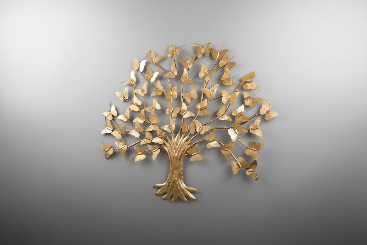 A wall-mounted decorative piece depicting a tree with butterflies, primarily in gold and gray colors.