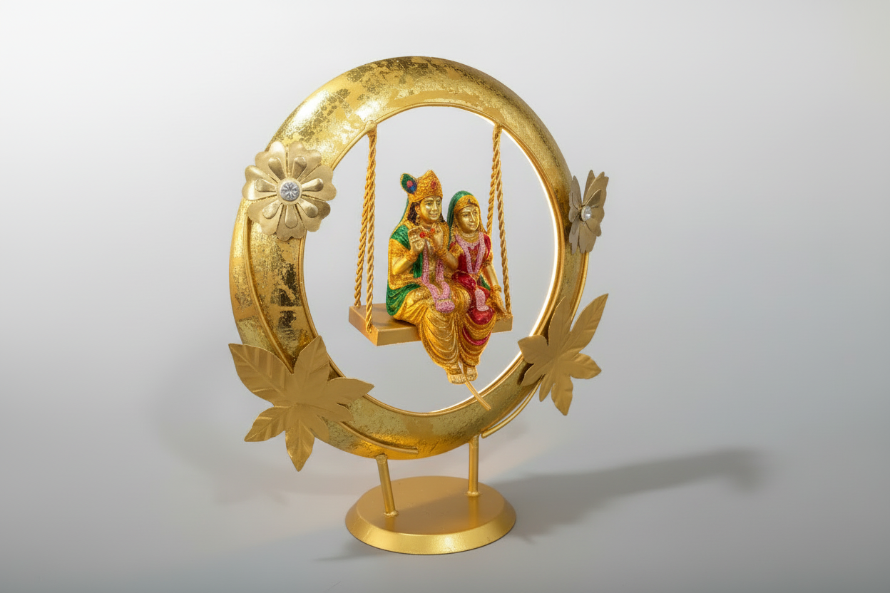 Agiftshop Radha Krishna Jhula statue with gold finish, red and green attire, on a decorative swing.