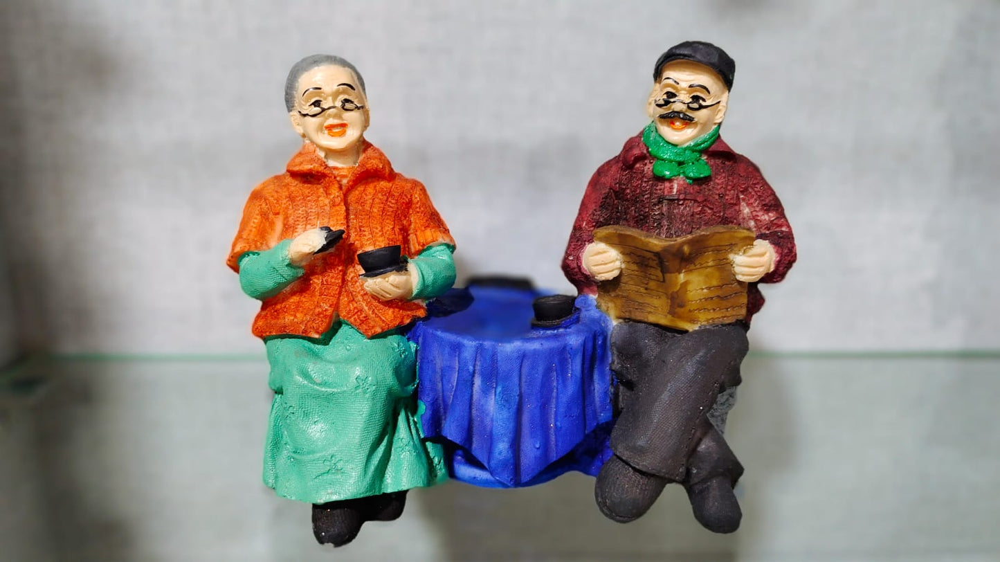 Italian Chit Chatting Old Couple Figurine Polyresin Decorative Showpiece