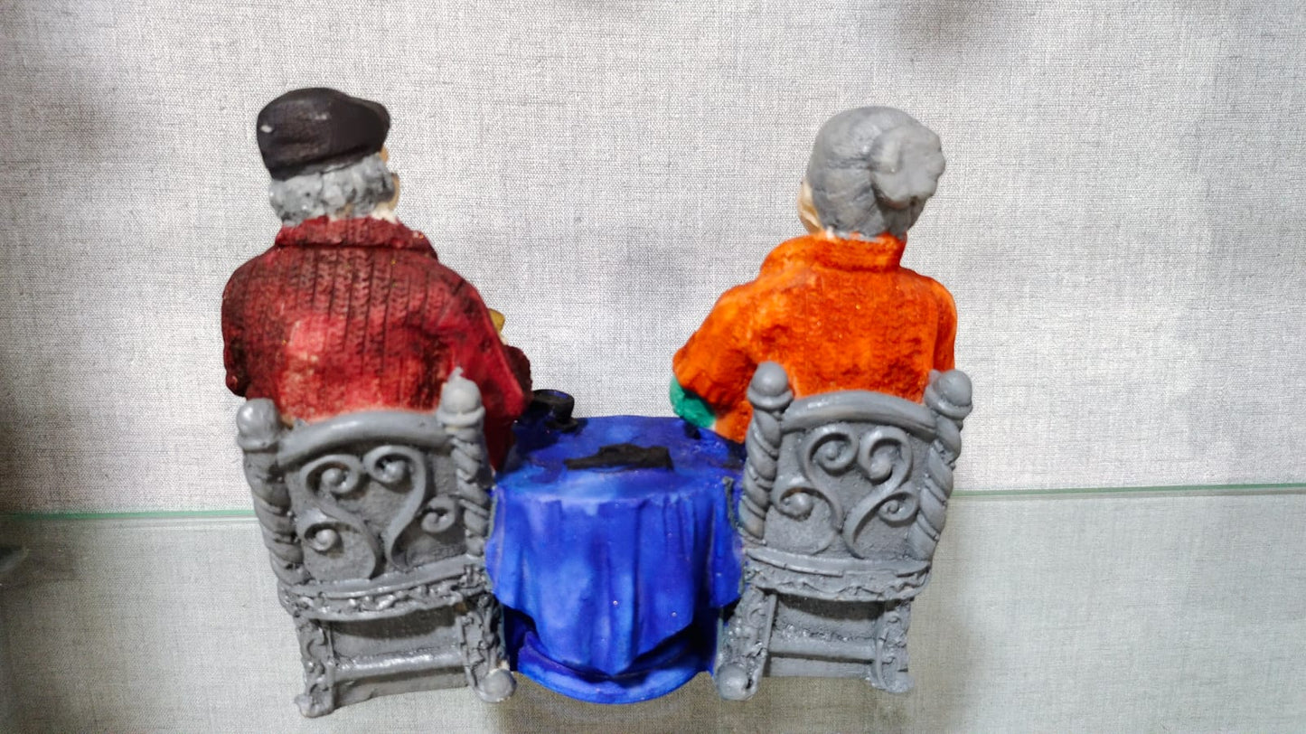 Italian Chit Chatting Old Couple Figurine Polyresin Decorative Showpiece