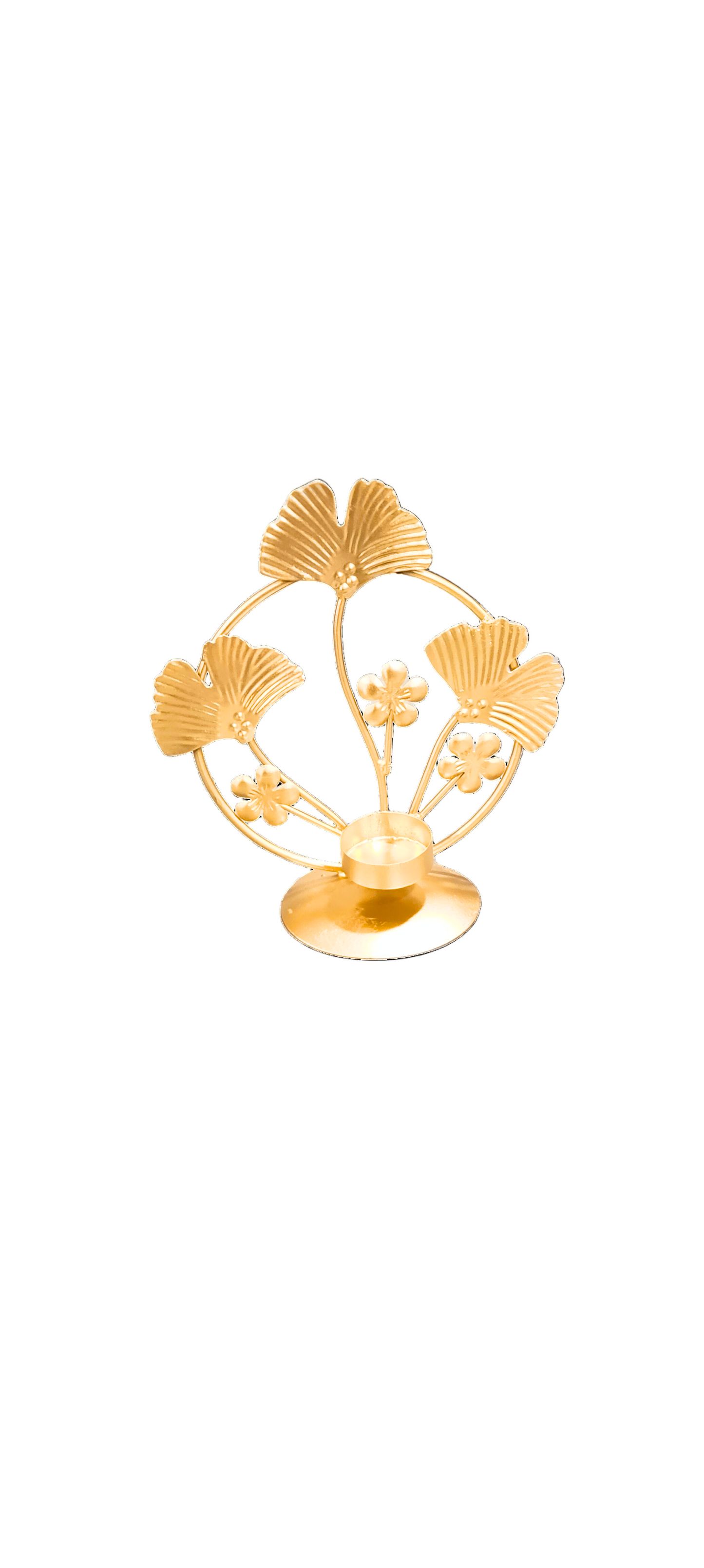 Gold decorative item with leaf design on a white background
