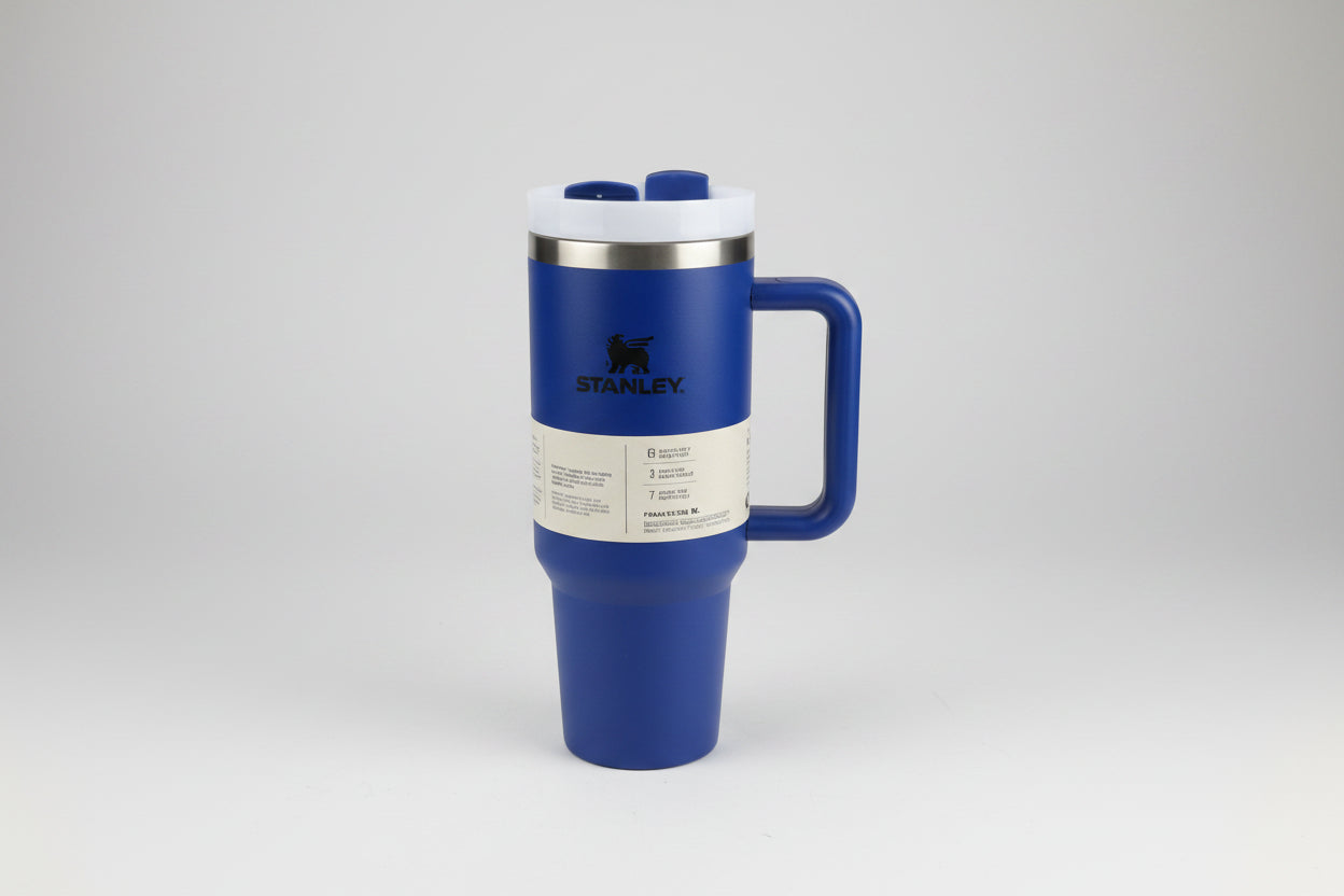 Blue travel mug with handle on a white background