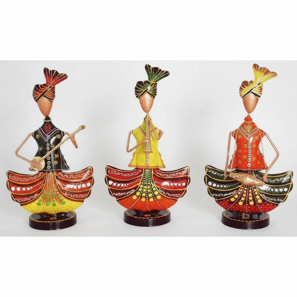 A set of three wrought iron figurines with vibrant multicolored finishes, depicting human figures in various poses and attire.