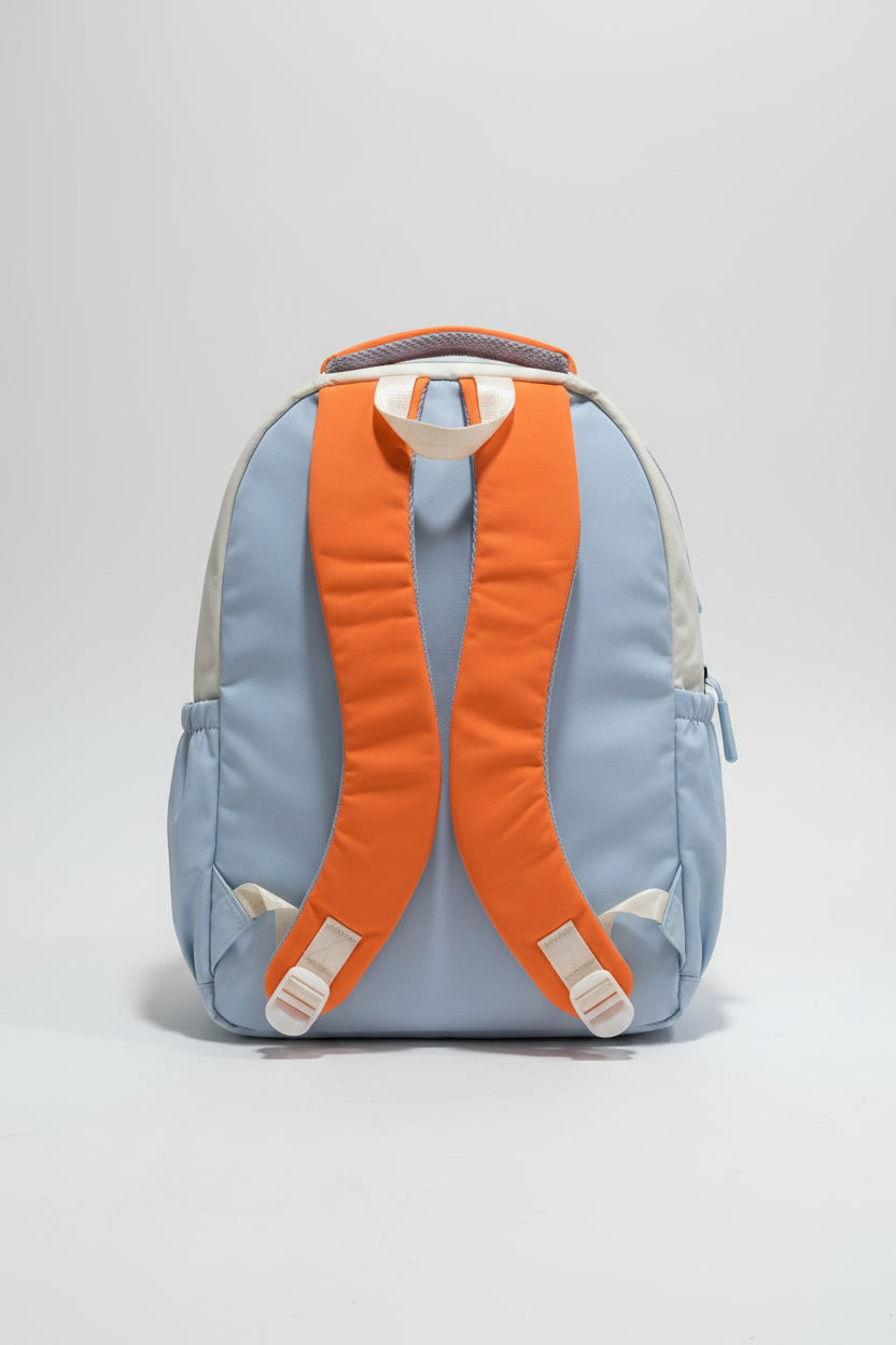Backpack with orange straps on a gray surface