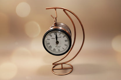 Decorative clock with a curved metal design