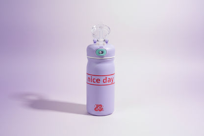 Purple water bottle with 'nice day' text on a white background