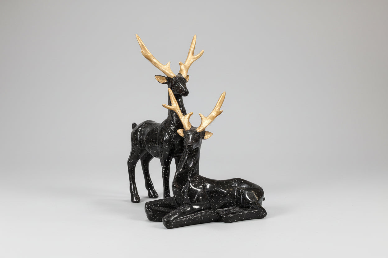 Black and gold deer figurine on a white background
