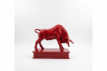 Red bull statue on a white background