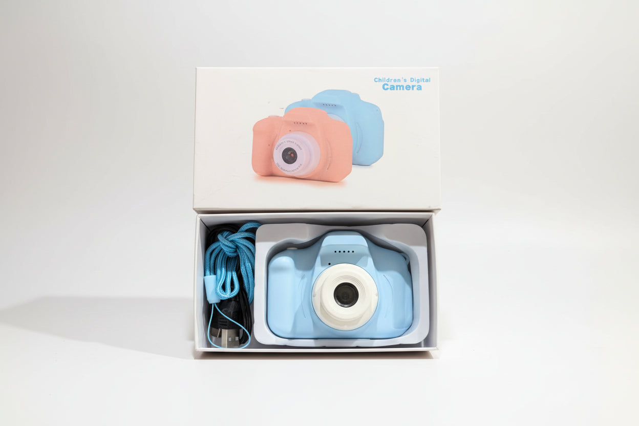 Children's digital camera with packaging on a white background
