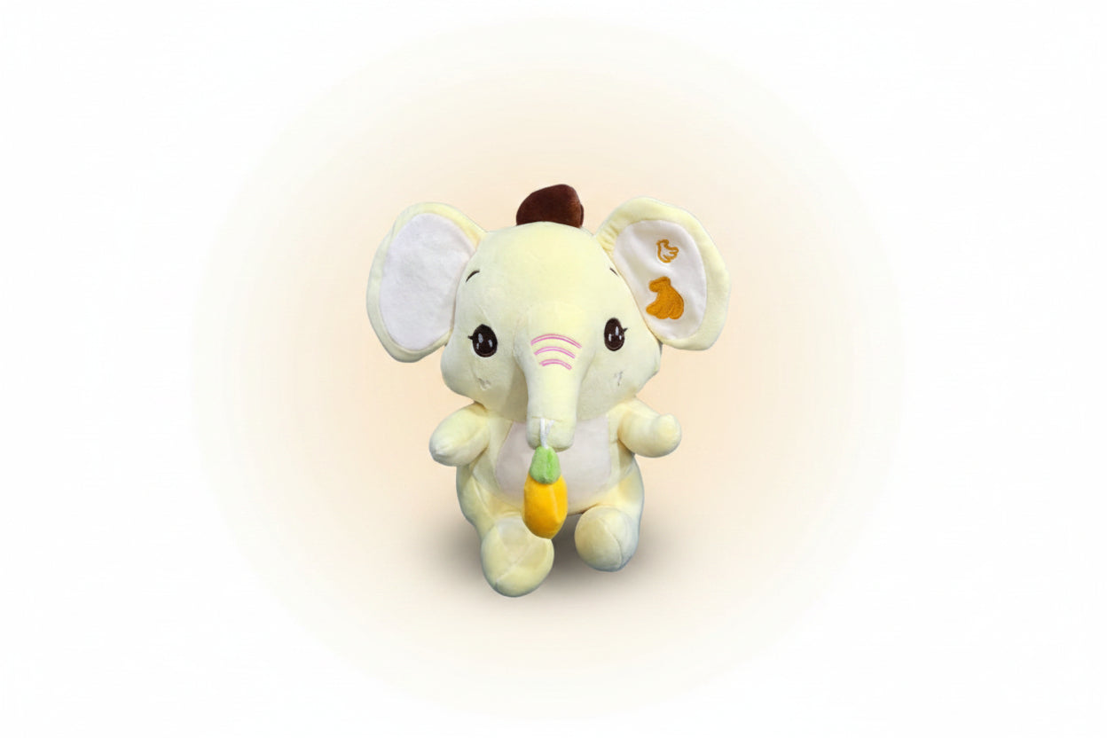 A plush toy resembling an elephant with a banana in its mouth, primarily in beige and white colors.