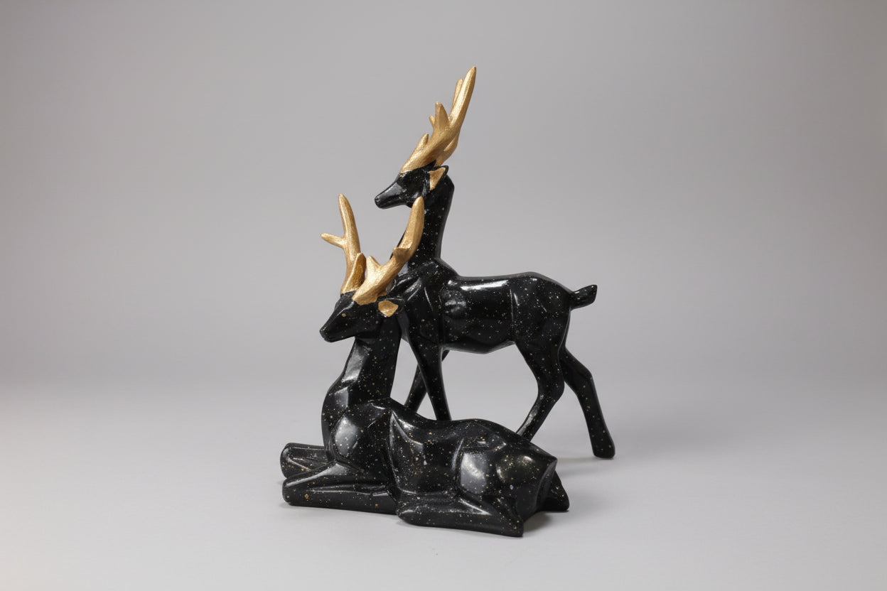 Black marble deer sculpture on a white background