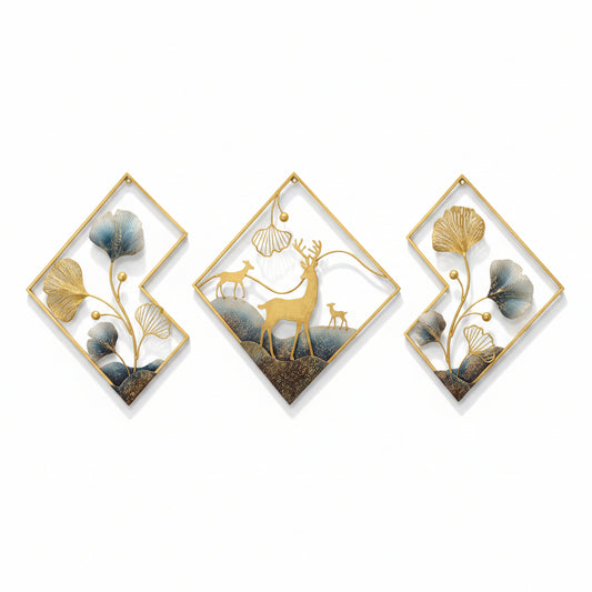 A set of three abstract multicolor metal wall sculptures featuring deer designs, displayed above a sofa with orange and blue cushions in a living room setting.