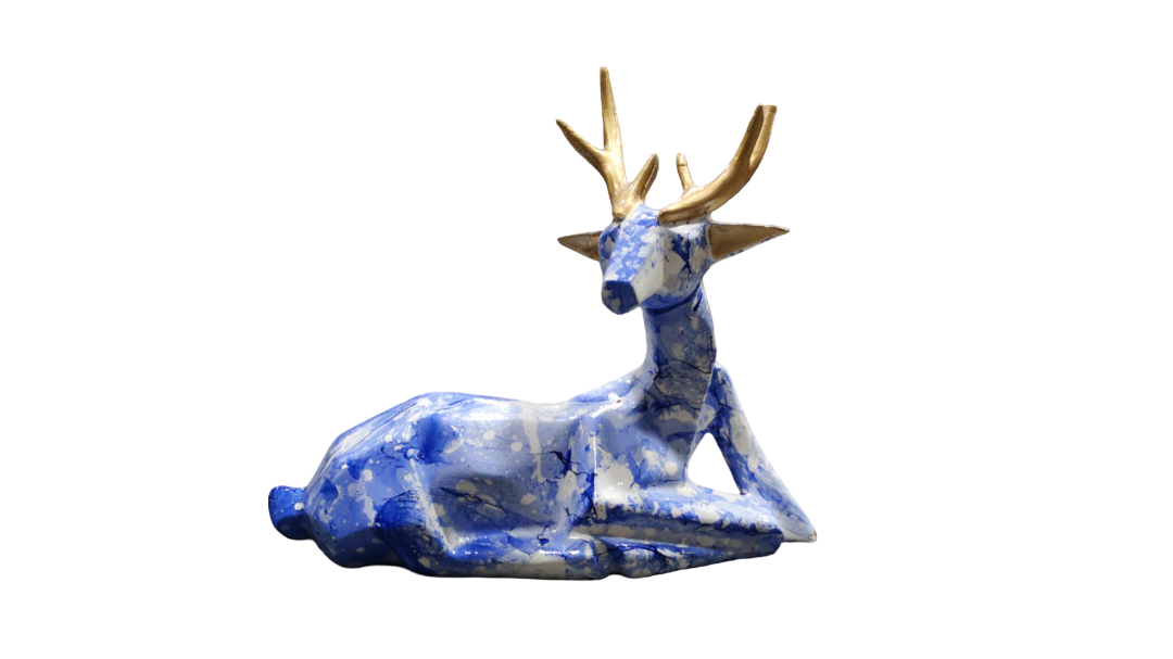 Decorative deer figurine with blue and white pattern on a white background