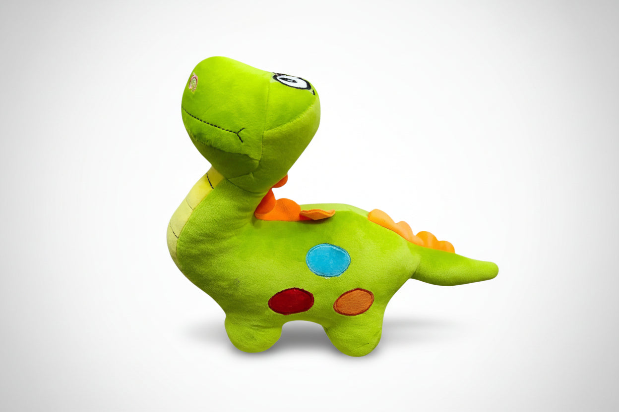 A colorful plush dinosaur soft toy with green as the dominant color and patches in orange and blue on its back and tail.