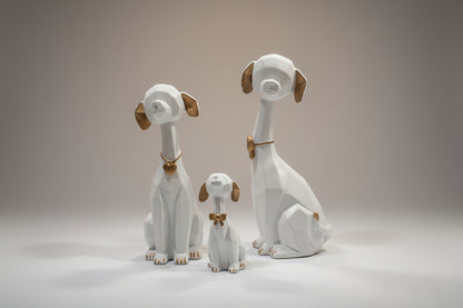 Set of dog figurines on a tiled floor with a blurred background