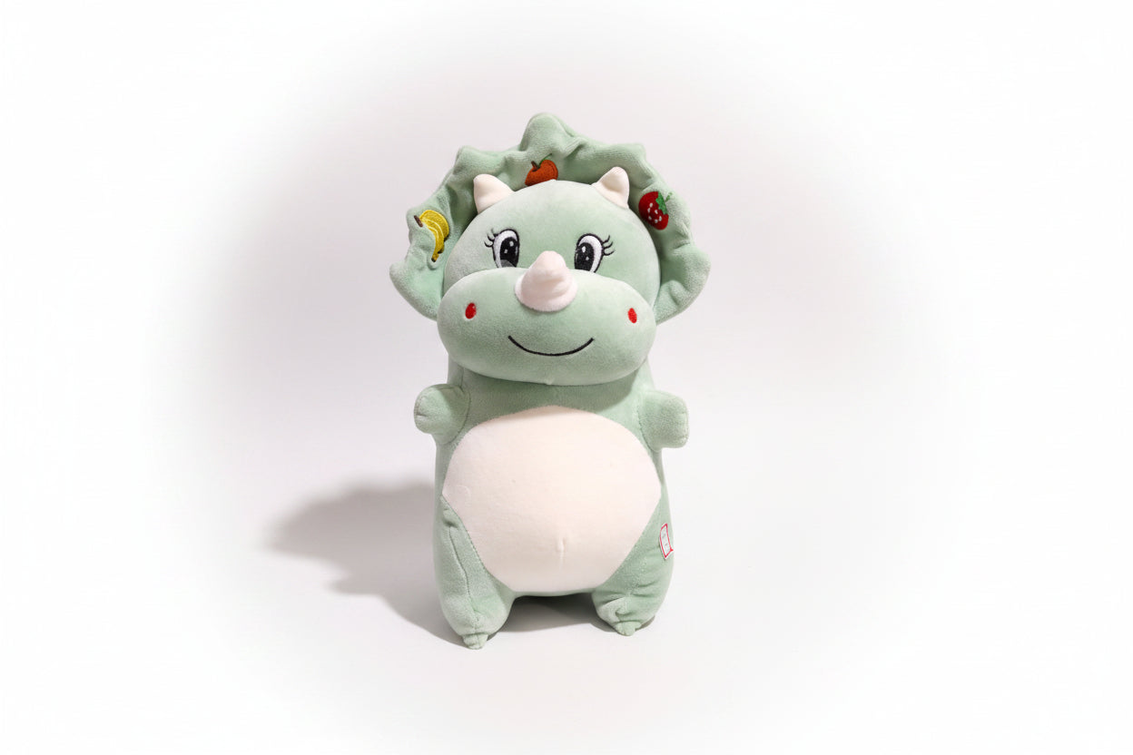 A plush Fruit Dragon soft toy with a green body, white belly, and multicolored fruit accents on its head.