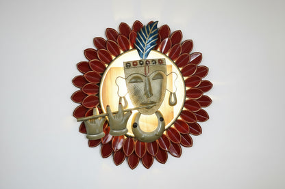 A metal wall decor featuring a multicolor design with LED lights, depicting the Hindu deity playing the flute, surrounded by a sun-like pattern.