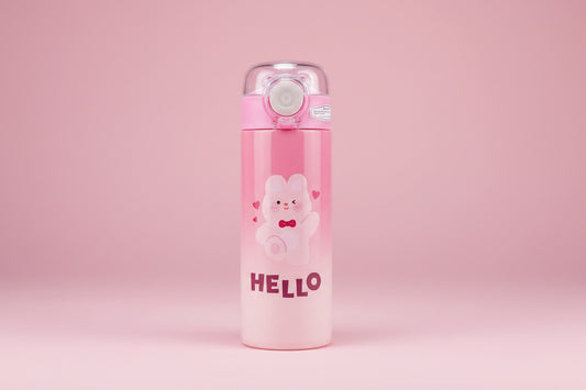 Pink thermos with cartoon bear design and 'HELLO' text on a gray surface.