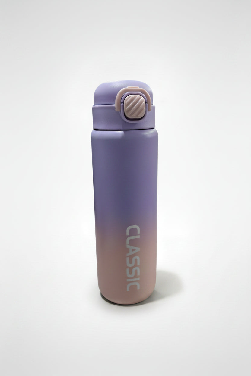 Gradient purple to pink water bottle with 'Classic' branding on a store floor.