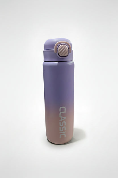 Gradient purple to pink water bottle with 'Classic' branding on a store floor.