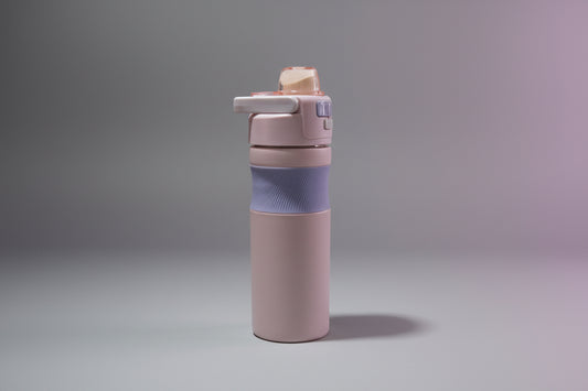 Purple water bottle with a blue sleeve on a white background