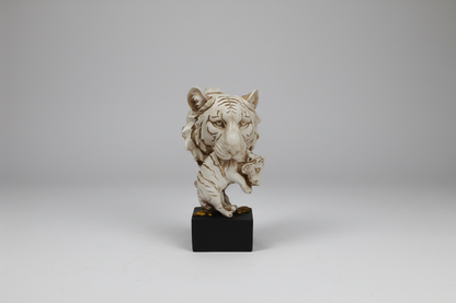 Decorative statue on a black base against a white background