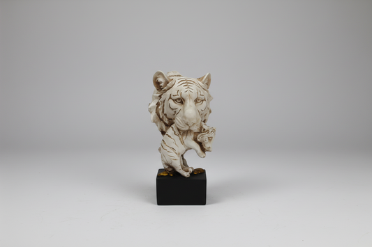 Decorative statue on a black base against a white background
