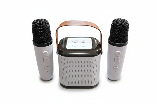 Portable speaker with two microphones on a white background