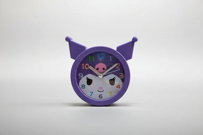 Children's clock with a purple border and cartoon face on a white background