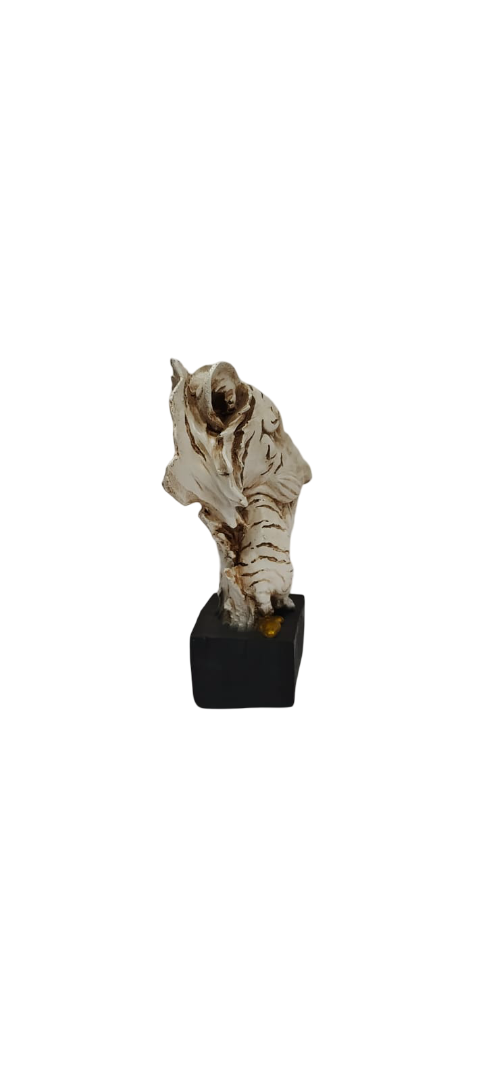 Decorative item resembling a tiger skull on a white background