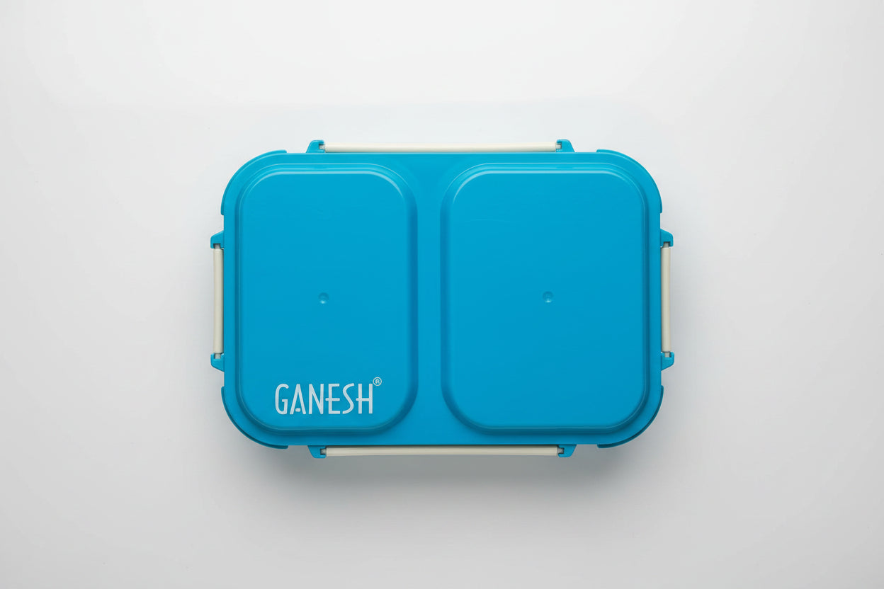 A blue leakproof steel lunch box with two compartments, the brand name 'Camek' is visible on the top edge.
