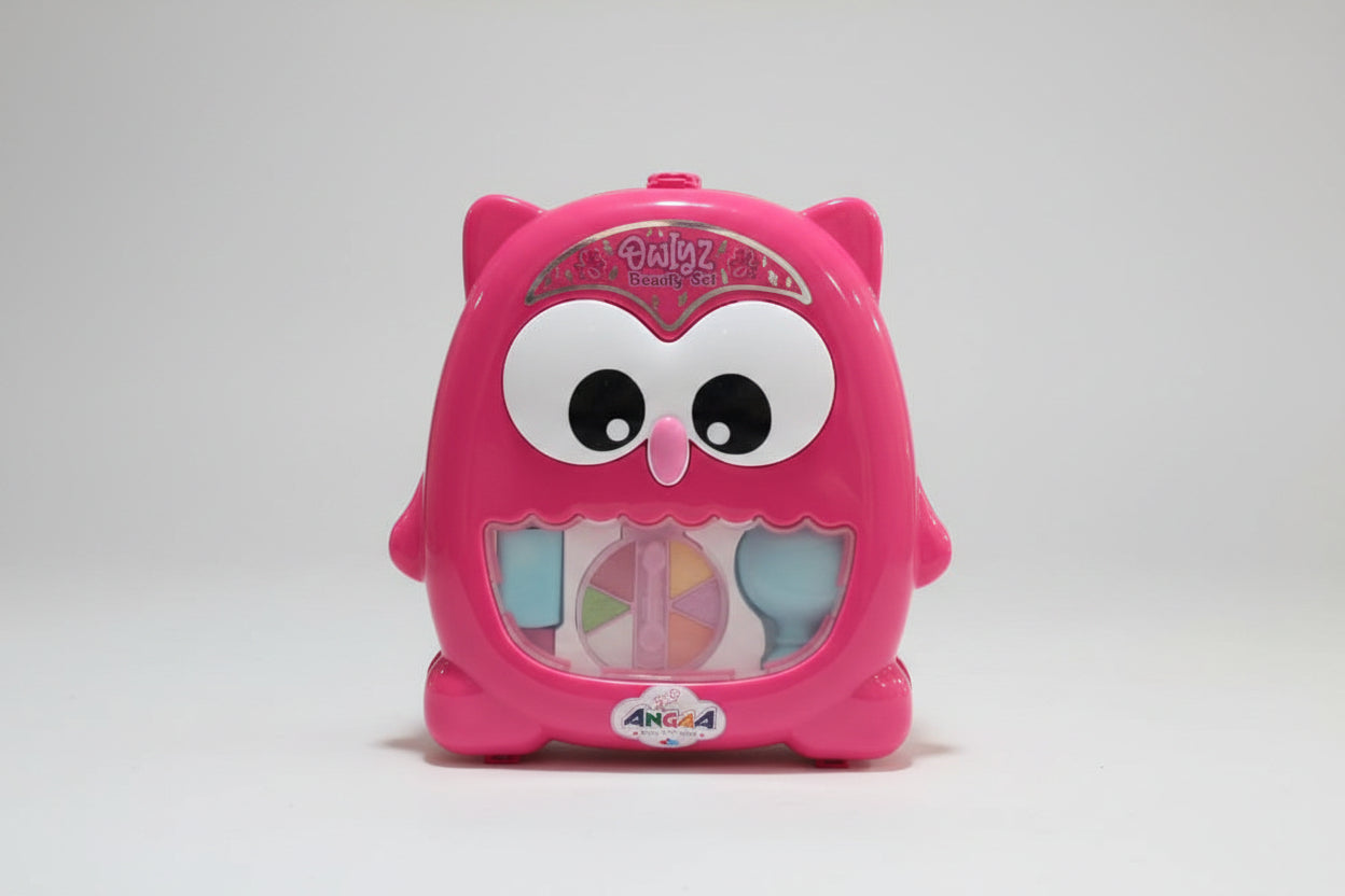 Pink owl-shaped makeup set with colorful compartments on a white background