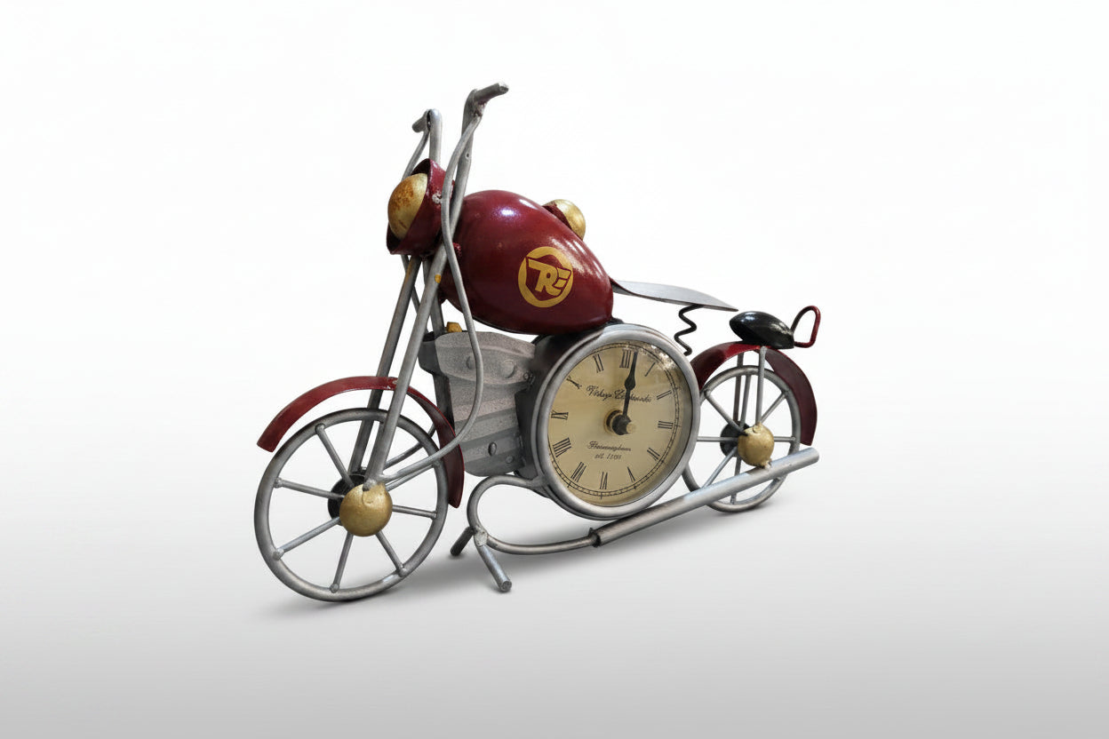 A decorative metal bike with a clock on the tabletop, primarily blue and silver in color.