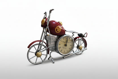 A decorative metal bike with a clock on the tabletop, primarily blue and silver in color.