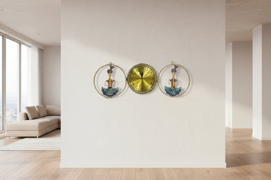 Decorative wall clock with two ornate figures on a plain background