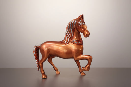 Bronze horse figurine on a white background
