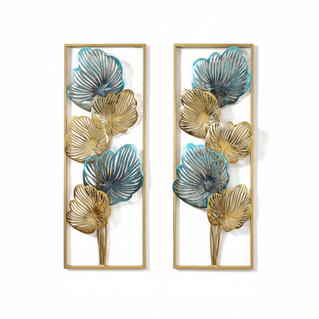 A set of two wrought iron wall panels with multicolor floral designs, displayed above a wooden console table with a classical statue on it, set against a light wall.