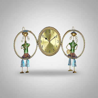A decorative wall clock featuring a golden-colored frame with a musical theme, including a figure of a conductor and a second figure, both with green and multicolored details.