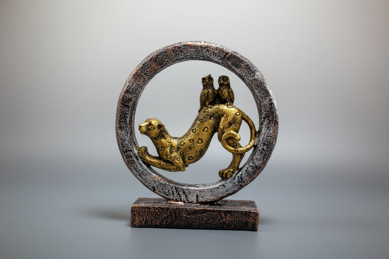 Decorative sculpture of a leopard inside a circular frame on a white background