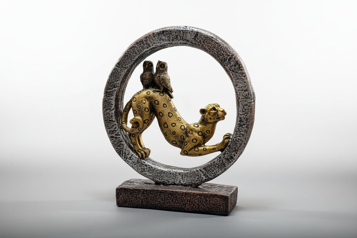 Decorative sculpture of a leopard inside a circular frame on a white background