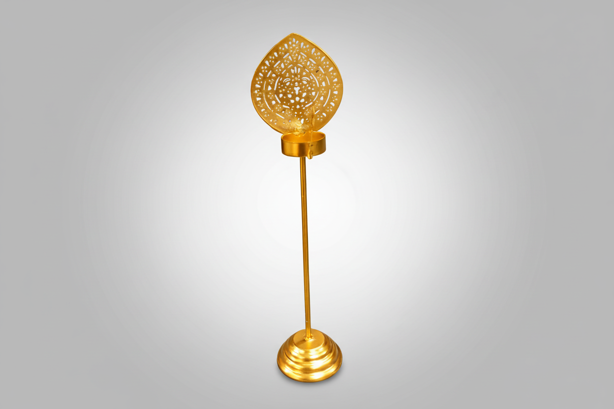 Decorative gold candle holder with intricate design.