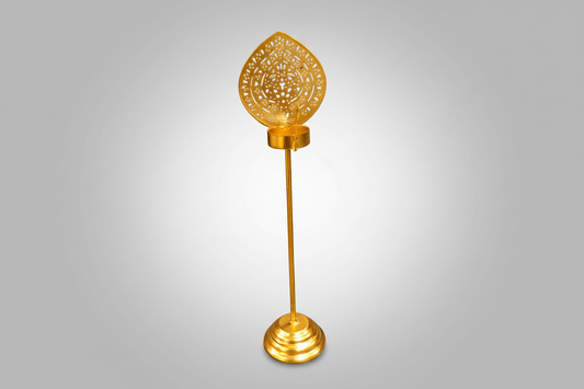 Decorative gold candle holder with intricate design.