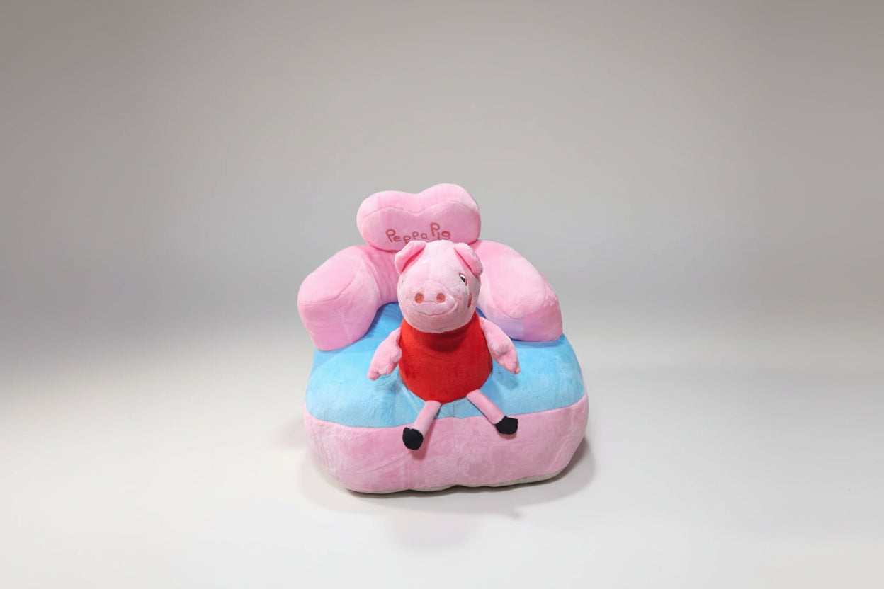 A plush baby sofa seat featuring the character Peppapig, with pink and blue colors.
