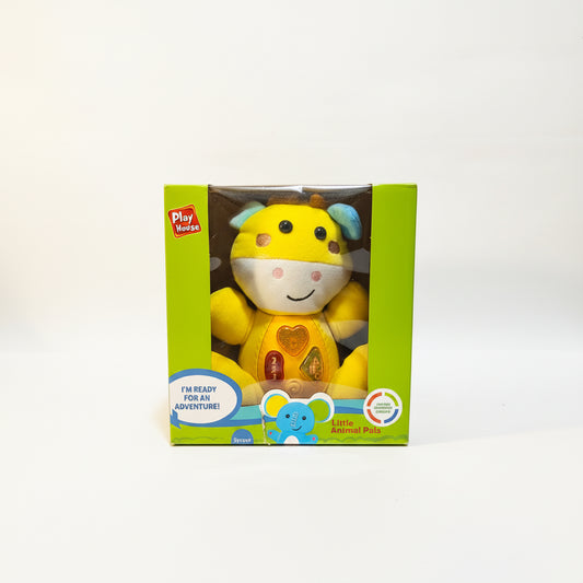 A plush musical toy in the shape of a yellow animal with a green stomach, packaged in a box labeled 'Play-A-Round' and 'I'm Heavy Adventure'.
