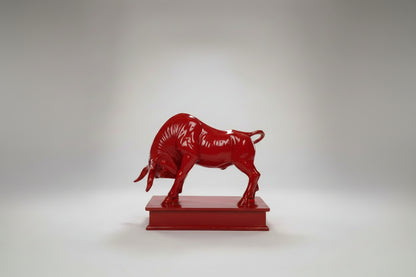 Red bull statue on a white background