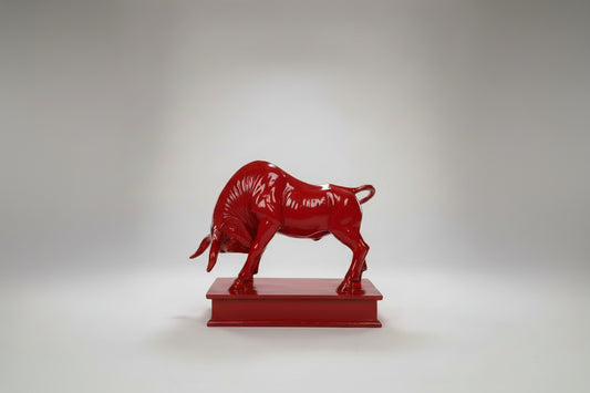 Red bull statue on a white background
