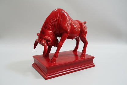 Red bull statue on a white background