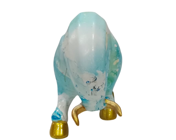 Decorative figurine of a parrot with a blue and white body on a white background