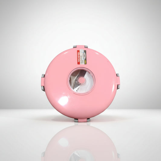 A pink round steel lunch box with a plastic spoon and a small box for sauces/vegetables.